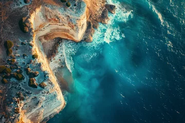 Fototapeten Coastal cliffs plunge into azure seas, revealing nature's dramatic coastline. © Hunman