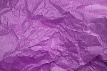 Fototapeta premium Сrumpled paper texture purple. Texture of crumpled paper. Crumpled paper. Wrinkles paper.