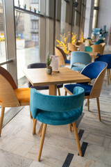 Modern cafe in loft style, black table set for coffee with brick wall. High quality photo