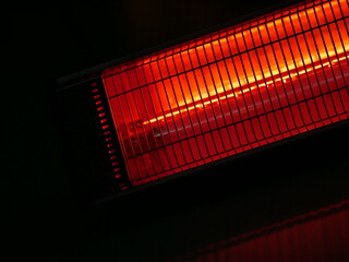 Infrared electrical heater on the wall in a street cafe. Warmth for visitors