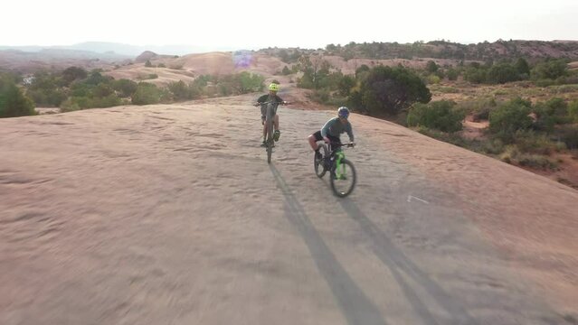 Mountain bike, path and friends in race, fitness challenge and extreme sports with balance and journey in South Africa safari. People cycling on bicycle for exercise and wheelie training in adventure