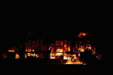 House Engulfed in Flames in the Dark