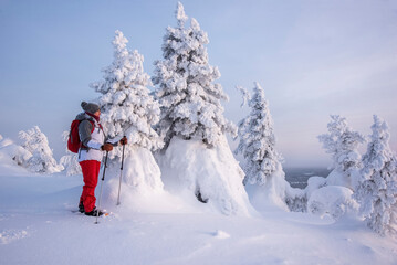 Woman snowshoeing in Lapland Finland