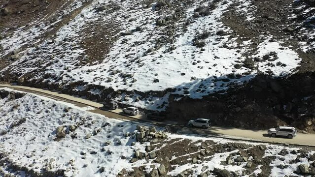 Aerial video of moving vehicles in the Himalayan Valley, Pakistan