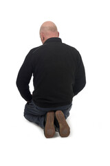 back view of a man kneeling on the floor in white background