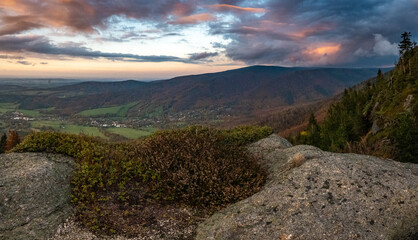 Autumn panorama of mountains and forests with a view of the sunset and forests with autumn colors of trees in the Jizera mountains in the Czech Republic