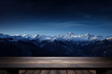 Empty wooden deck table with views of snowy mountains. With room for products