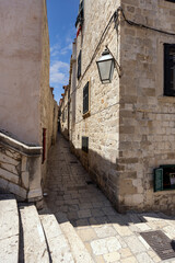 Fototapeta na wymiar View of picturesque narrow street next baroque Jesuit Stairs, Dubrovnik; Croatia