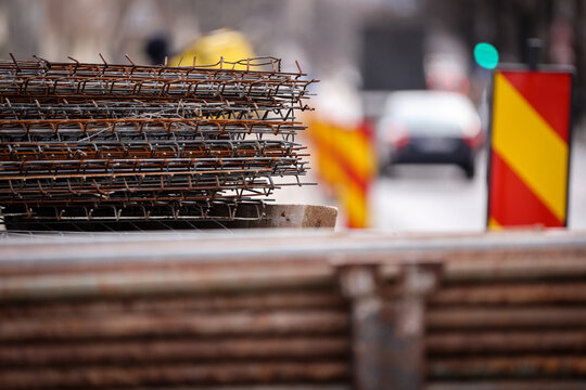 Big stack of iron bars used in road construction and tram rail reconstruction