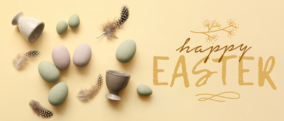 Holders with Easter eggs and feathers on beige background