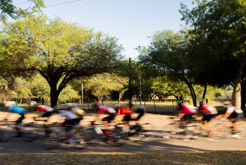 group of cyclists competing in speed race