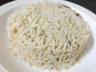 Cooked white rice in a plate closeup photo