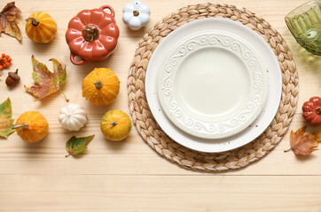 Beautiful table setting for Thanksgiving Day celebration on light wooden background