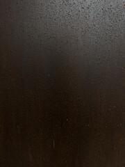 weathering steel panel covered with raindrops