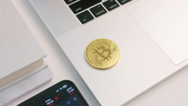 Bitcoin cryptocurrency on laptop keyboard 