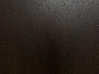 weathering steel panel covered in raindrops