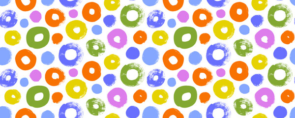 Seamless banner design with kid's style circles and dots. Brush drawn bold circles with grunge texture.
