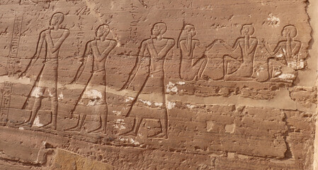 Ancient egyptian carvings at the tombs of Nobles in Aswan, Egypt