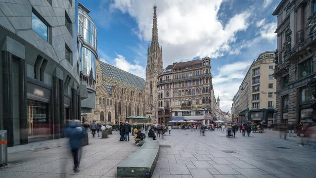 Vienna St. Stephen's Cathedral (Stephansdom) is the mother church of the Roman Catholic Archdiocese of Vienna timelapse, hyperlapse video. People walking on The Stephansplatz square, Vienna Austria