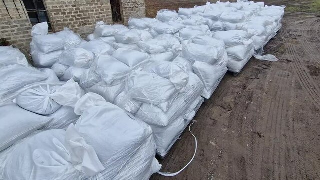 loading of seed, grain. humanitarian aid in war-affected areas. food allowances for children at risk of famine in the regions. pallet on a forklift with fertilizer