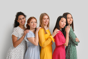 Beautiful young happy women on white background. Women history month