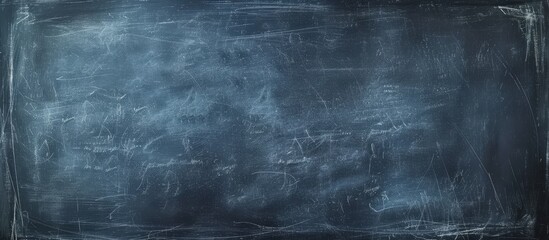 A close up of an electric blue chalkboard with intricate font patterns mimicking water, sky, and...