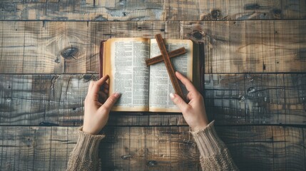 beautiful girl holding a cross over the bible on a wooden table in high resolution and quality
