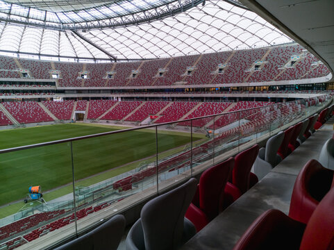 Warsaw, Poland - October 12 2023: Beautiful and big tribune with white and red chairs of polish national stadium PGE Narodowy