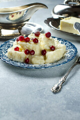 Dessert with cottage cheese and red berries on a plate