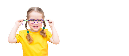 Funny girl wearing glasses and a yellow T-shirt on a white background. Banner.