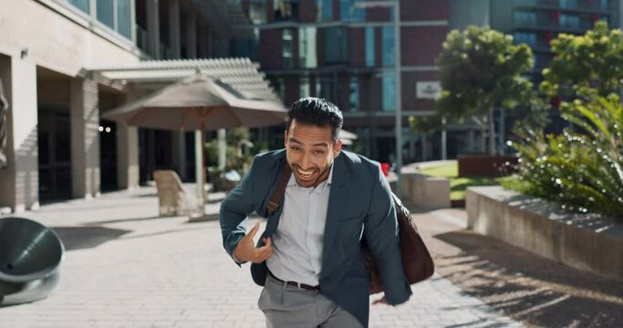 Happy, smile and businessman dancing in city for good news, achievement or celebration. Excited, success and professional young male person moving and singing with briefcase to music in urban town.