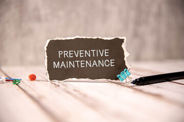 Preventive Maintenance text written on a notebook with pencils