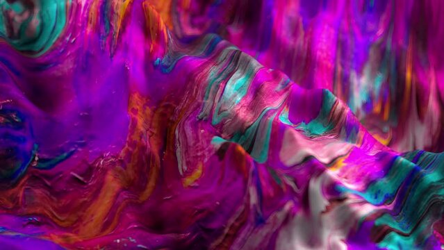 Vibrant, colorful, fluid and wavy abstract paint seamless loop animation. Modern and contemporary style in 4K with shades of purple, pink, magenta, cyan, orange