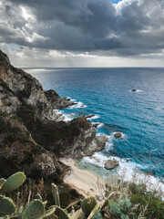 Rough Ocean waves near the mountains and cliff