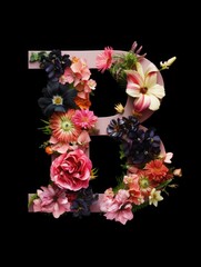 Letter B made of real natural flowers and leaves, on a black background. Spring, summer and valentines creative idea.