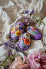 Colorful hand painted Easter eggs on retro fabric. The concept of Easter holidays, retro, handcraft, as it used to be.