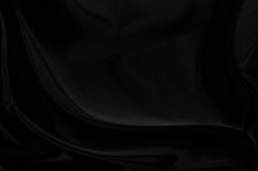 Black gray satin dark fabric texture luxurious shiny that is abstract silk cloth background with patterns soft waves blur beautiful.