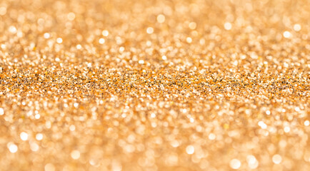 Golden glitter texture background with sequins and sparkles