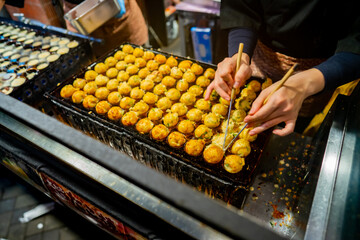 process to cooking takoyaki most popular delicious street food at Dotonbori or dotombori, Dotonbori...