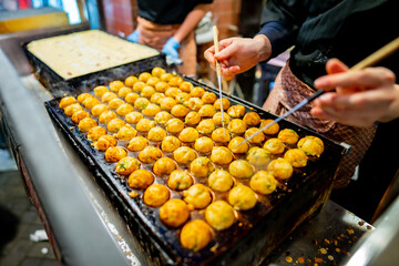 process to cooking takoyaki most popular delicious street food at Dotonbori or dotombori, Dotonbori...