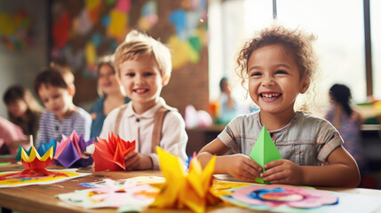 happy kids doing arts and crafts in day care centre - Powered by Adobe
