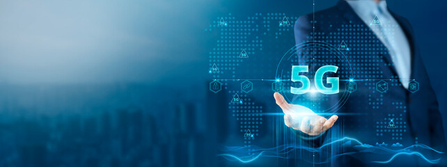 5G Technology: Businessman Holding 5G Network Innovation on Global Technology Network, Connectivity, Speed, and Efficiency.