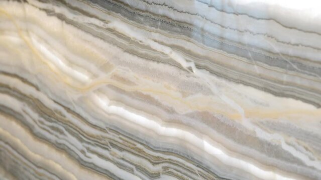 Close up of marble effect tile for abstract interior or exterior home decoration of wall or floor surface design in pattern of natural stone material in beige and grey colour 