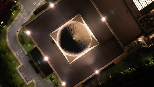 Aerial top-down view rotating of Masjid Sri Sendayan, mosque at night.