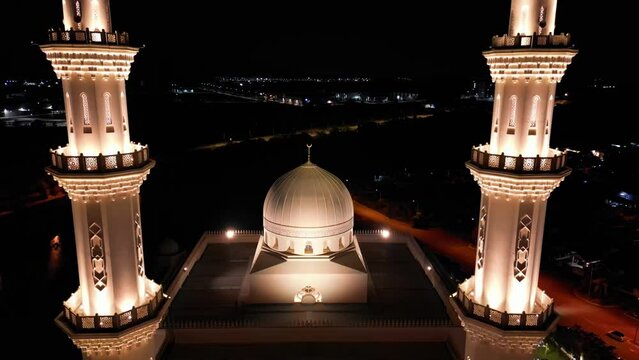 Seremban, Malaysia - February 2024. Aerial view moving foward of Masjid Sri Sendayan, mosque at night.