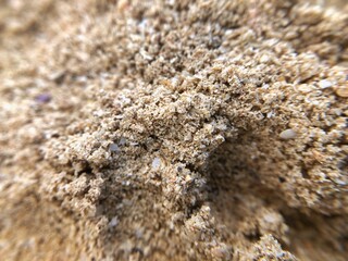 Defocused macro texture of dirty beach sand