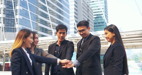 Fototapeta premium Multiethnic Teamwork friendship group brainstorming togetherness. Business people team holding hands Solidarity. Diversity business partner people teamwork holding hands together power of tag team