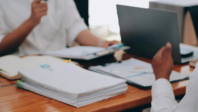 Team of business people are meeting to analyze data for marketing plan,Market research reports and income statistics, Financial and Accounting concept.