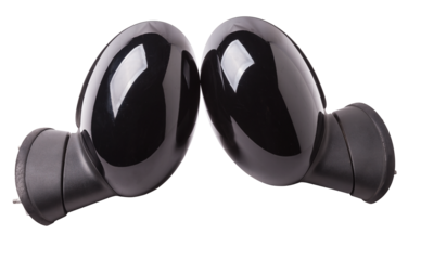 Close-up on a pair of side mirrors from a minibus with turn signal repeaters for repair and replacement after an accident in a workshop. Auto service industry. Spare parts catalog.