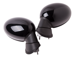 Close-up on a pair of side mirrors from a minibus with turn signal repeaters for repair and replacement after an accident in a workshop. Auto service industry. Spare parts catalog.